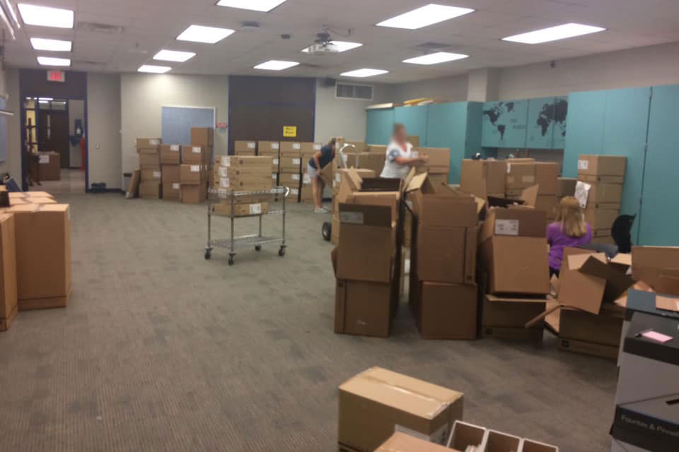 A room full of boxes being unpacked.