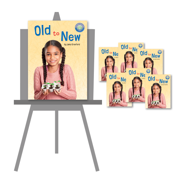 Big book version of 'Old to New' on an easel, along with six small copies of the book.