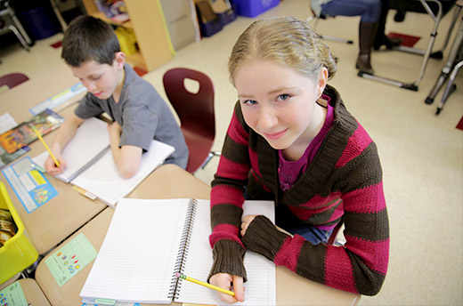 Student writing in Reader's Notebook